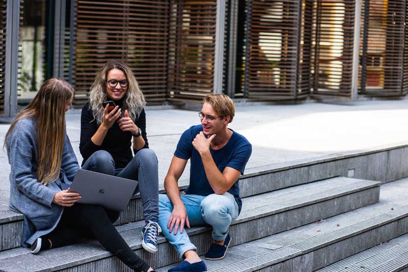 Image of young people studying with a laptop